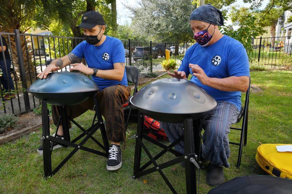 Stan Shaposhnikov (left) and John Guinta perform on their handpan drums as part of a nonprofit called Streams of Sound.