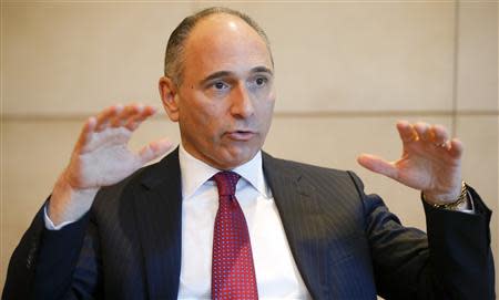 Joe Jimenez, CEO of Swiss drugmaker Novartis gestures during an interview with Reuters at the company's headquarters in Basel March 19, 2014. Reuters/Arnd Wiegmann