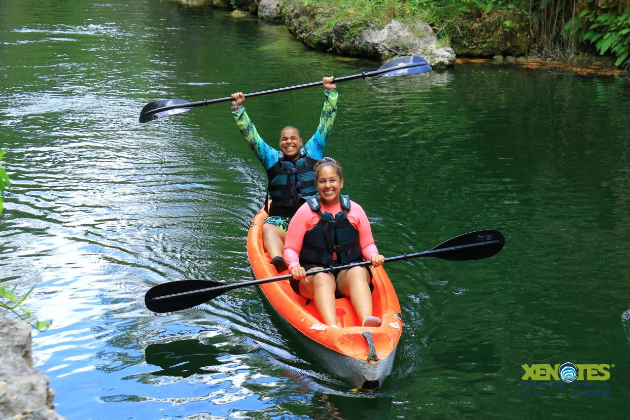 Hector Garcia and his mother on a kayak.