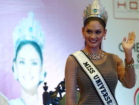 Miss Universe 2015 Pia Wurtzbach waves during a news conference at a hotel in Quezon city, metro Manila January 24, 2016, after her return to the Philippines. REUTERS/Romeo Ranoco