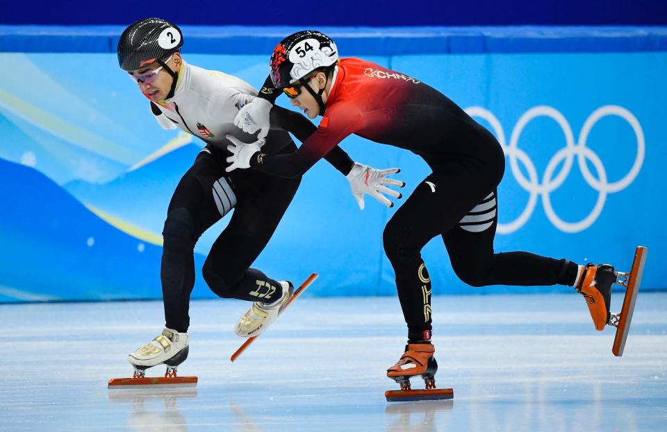 Ren (right) grabs Shaolin Liu down the final stretch.