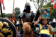 A group of royalists protest in front of parliament as they counter protest pro-democracy demonstrators and show support to the monarchy in Bangkok