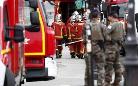 French police and security forces establish a security perimeter near Paris police headquarters - Credit: IAN LANGSDON/EPA-EFE/REX&nbsp;