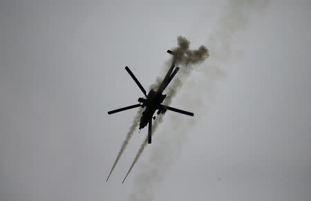 An Iraqi Air Force helicopter fires missiles against Islamic State militants during a battle in Mosul, Iraq March 19, 2017. REUTERS/Thaier Al-Sudani