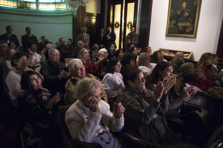 Relatives and victims of South American military dictatorships react as they hear the verdict in the trial on Operation Condor, in Montevideo on May 27, 2016