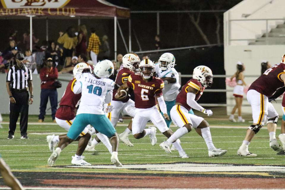 ULM Quarterback Chandler Rogers (6) looks for a running lane against Coastal Carolina