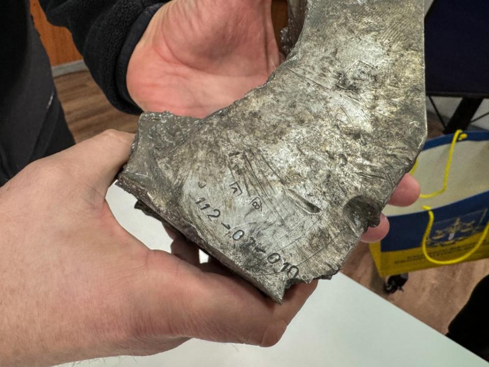 KHARKIV, UKRAINE - MARCH 14: Chief of the Kharkov Prosecutor's Office Oleksandr Filchakov holds fragments of a North Korean missile during a briefing on Russia's shelling of Kharkov by North Korean missiles on March 14, 2024 in Kharkov, Ukraine. During the briefing, the head of the Kharkov Prosecutor's Office displayed a fragment of a North Korean missile that Russian forces fired on Kharkov on January 2, 2024. After the attack, law enforcement officials found a fragment of one of the missiles, which was identified by national and international expert institutes as a North Korean KN-23 missile. (Photo by Denys Glushko/Gwara Media/Global Images Ukraine via Getty Images)