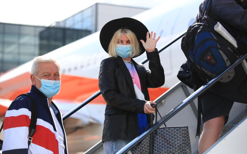 UK passengers prepare to board a flight to Faro on May 17 - Gareth Fuller