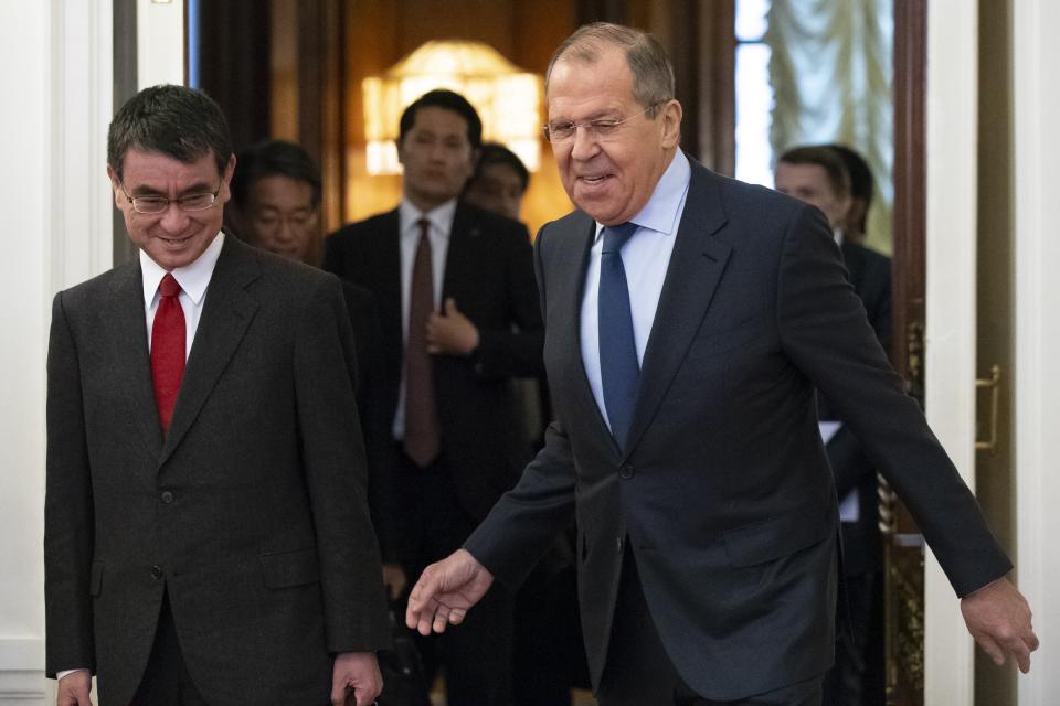 Russian Foreign Minister Sergey Lavrov, right, and Japanese Foreign Minister Taro Kono enter a hall for their talks in Moscow, Russia, Monday, Jan. 14, 2019. (AP Photo/Alexander Zemlianichenko)