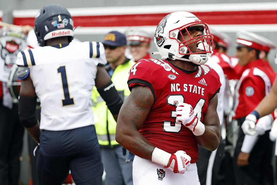 North Carolina State's Delbert Mimms III (34) celebrates his touchdown during the first half of an NCAA college football game against the Charleston Southern in Raleigh, N.C., Saturday, Sept. 10, 2022. (AP Photo/Karl B DeBlaker)