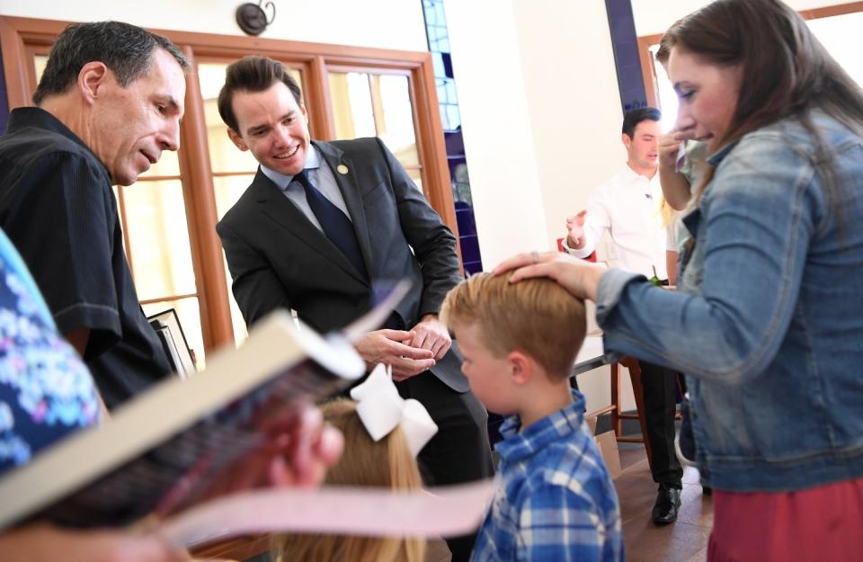 Recall candidate Assemblyman Kevin Kiley speaks with parishioners