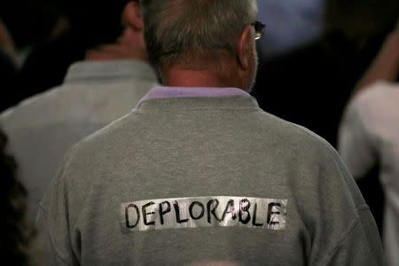 A supporter of Republican presidential nominee Donald Trump stands in the audience at a campaign rally in Laconia, New Hampshire, U.S., September 15, 2016. REUTERS/Mike Segar