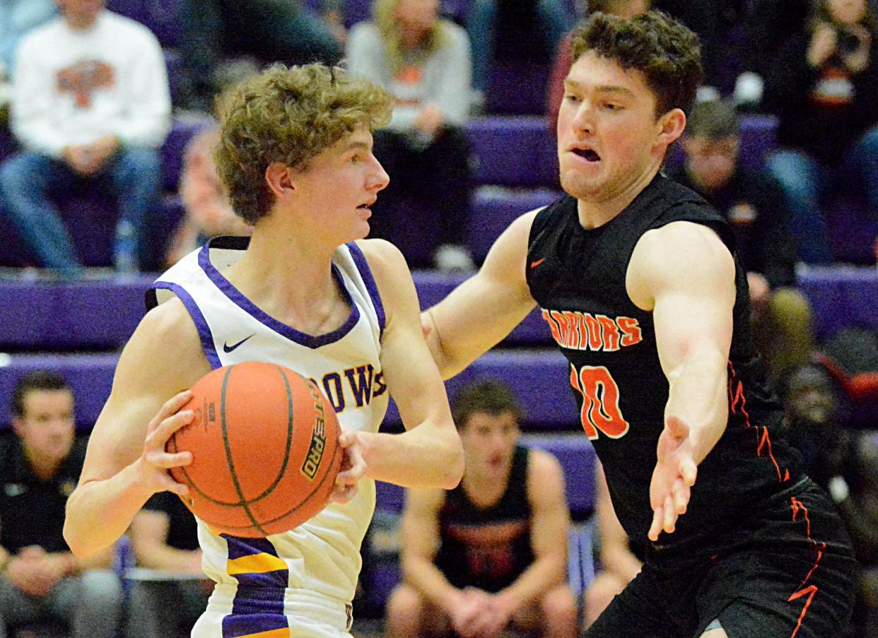 Watertown' Dylon Rawdon (left) is pressured by Sioux Falls Washington's Tryg Auten during a high school boys basketball game on Friday, Feb. 3, 2023 in the Watertown Civic Arena.