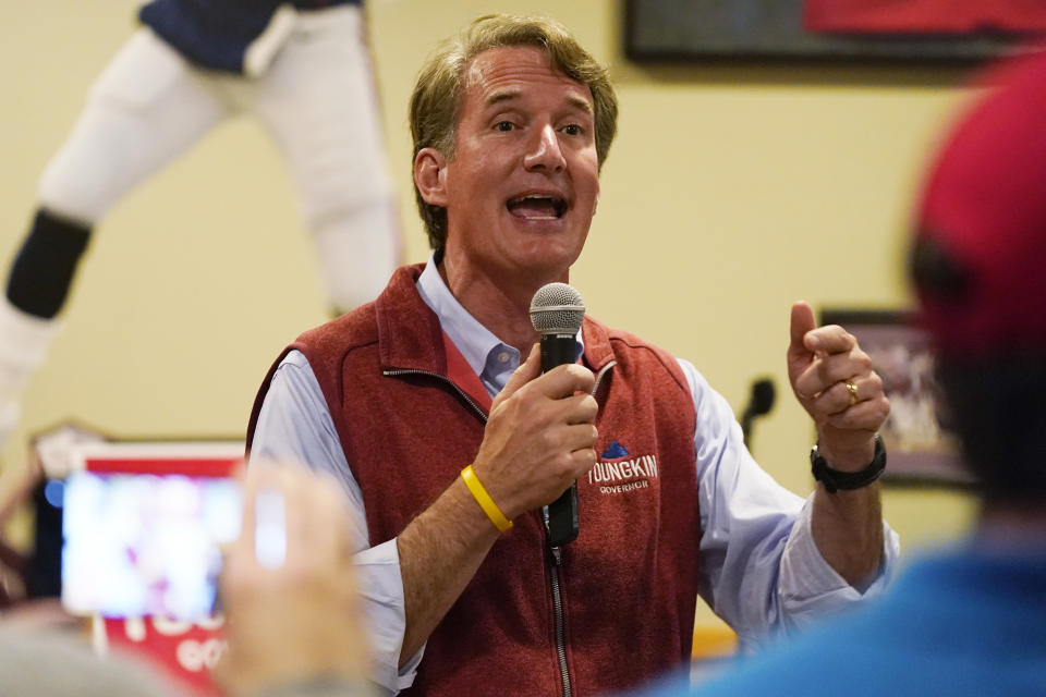 Virginia Republican gubernatorial candidate Glenn Youngkin gestures as he talks with supporters during a meet and greet at a sports bar in Chesapeake, Va., Monday, Oct. 11, 2021. Youngkin faces former Governor Terry McAuliffe in the November election. (AP Photo/Steve Helber)