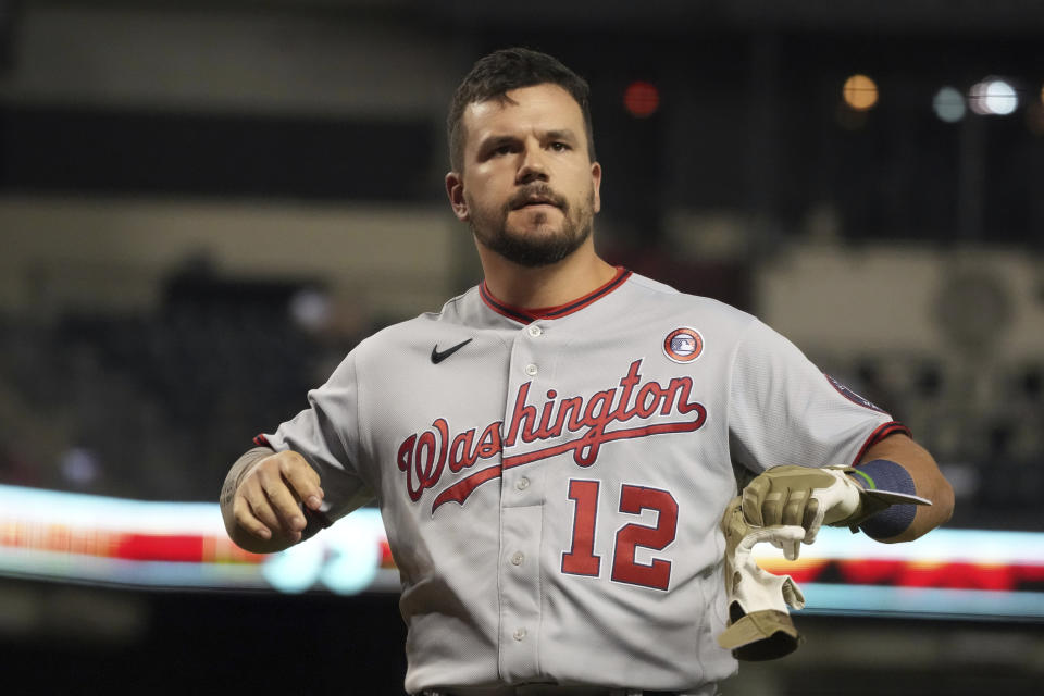 Washington Nationals' Kyle Schwarber reacts after striking out against the Arizona Diamondbacks during the seventh inning of a baseball game Saturday, May 15, 2021, in Phoenix. (AP Photo/Rick Scuteri)