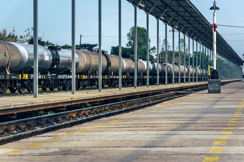 Rail tanker cars lined up on the track.