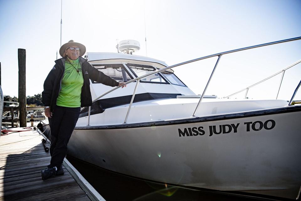 Captain Judy Helmey of Miss Judy Charters with her offshore fishing vessel "Miss Judy Too."