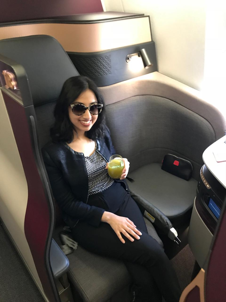 This is me after I did a little happy dance after boarding the Q-suite business class experience from Sydney to Doha. Photo: Yahoo Lifestyle