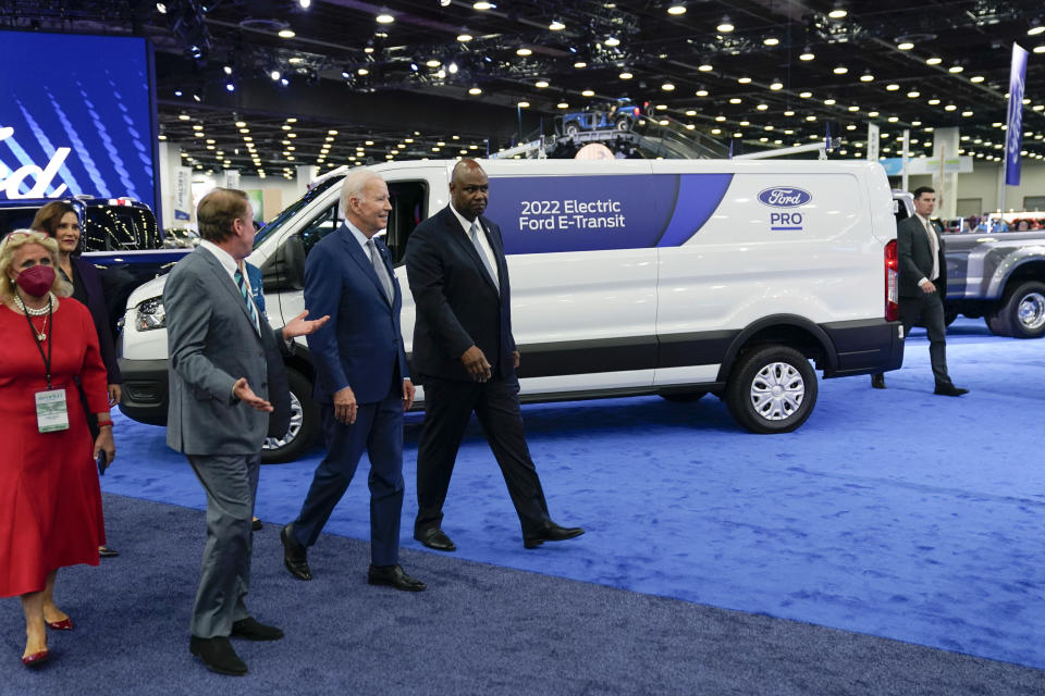 FILE - President Joe Biden listens during a tour at the Detroit Auto Show, Sept. 14, 2022, in Detroit. From left, Rep. Debbie Dingell, D-Mich., Michigan Gov. Gretchen Whitmer, Bill Ford, executive chairman of Ford Motor Company, Biden and Ray Curry, President of the United Auto Workers. (AP Photo/Evan Vucci, File)