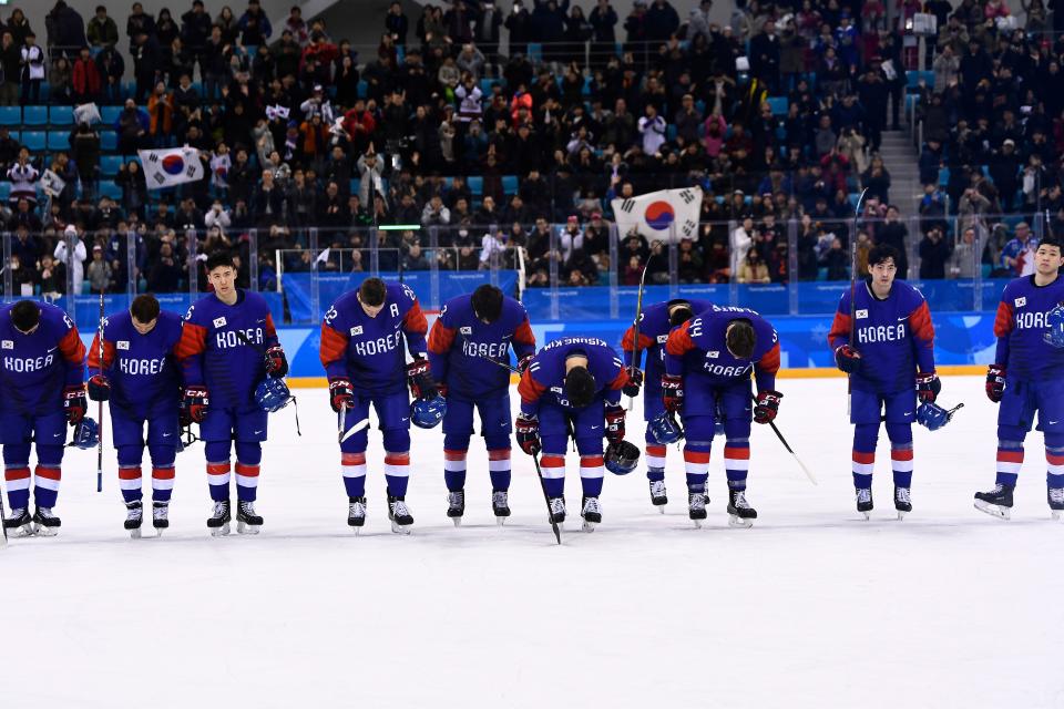 Team South Korea bows after losing a men’s preliminary round ice hockey match between South Korea and Switzerland. Brendan Smialowski/AFP/Getty Images)