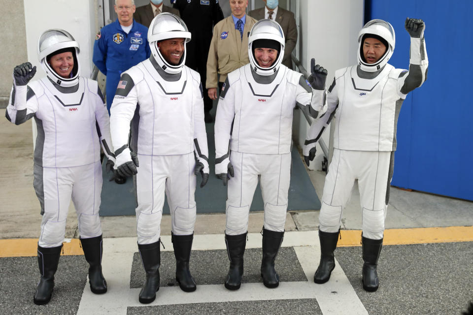 NASA astronauts, from left, Shannon Walker, Victor Glover, and Michael Hopkins and Japan Aerospace Exploration Agency astronaut Soichi Noguchi leave the Operations and Checkout Building on their way to launch pad 39A for the SpaceX Crew-1 mission to the International Space Station at the Kennedy Space Center in Cape Canaveral, Fla., Sunday, Nov. 15, 2020. (Photo/John Raoux)