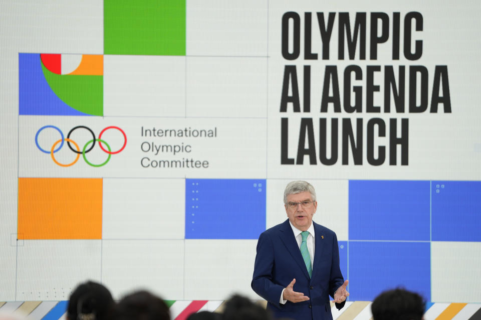 Thomas Bach, IOC President speaks at the International Olympic Committee launch of the Olympic AI Agenda at Lee Valley VeloPark, in London, Friday, April 19, 2024. The IOC will be presenting the envisioned impact that artificial intelligence can deliver for sport, and how the IOC intends to lead on the global implementation of AI within sport. (AP Photo/Kirsty Wigglesworth)