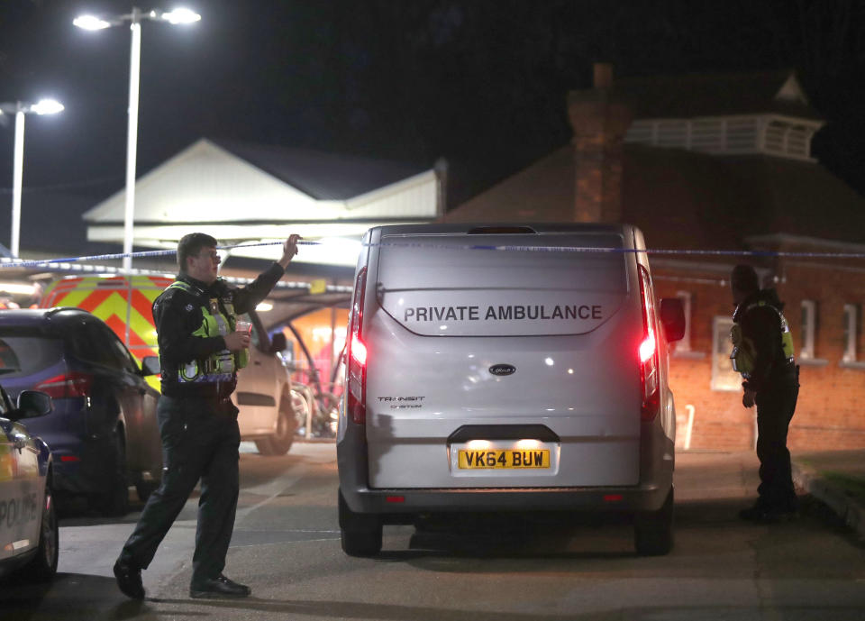 A private ambulance arrives at Horsley station near Guildford, Surrey, after a murder inquiry was launched following the stabbing of a man on board a train in Surrey. (PA)