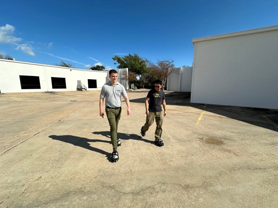 KXAN’s Eric Henrikson tests out Moonwalkers. (Credit: Tim Holcomb/KXAN)