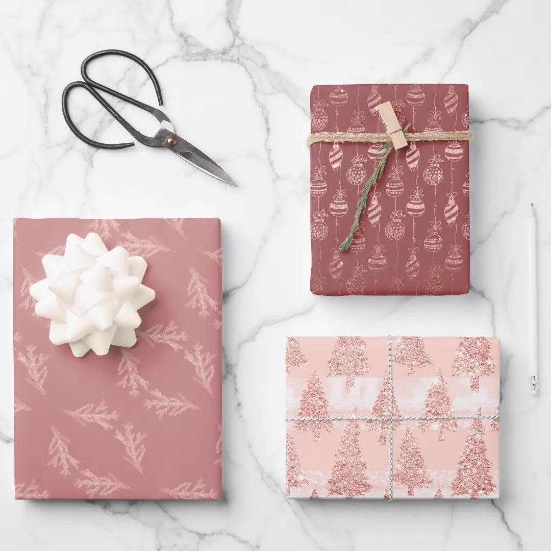 <p><a href="https://go.redirectingat.com?id=74968X1596630&url=https%3A%2F%2Fwww.zazzle.com%2Felegant_rose_gold_glitter_pink_christmas_trio_gift_wrapping_paper_sheets-256360223372198837&sref=https%3A%2F%2Fwww.thepioneerwoman.com%2Fholidays-celebrations%2Fgifts%2Fg41544243%2Fbest-christmas-wrapping-paper%2F" rel="nofollow noopener" target="_blank" data-ylk="slk:Shop Now;elm:context_link;itc:0;sec:content-canvas" class="link rapid-noclick-resp">Shop Now</a></p><p>Elegant Rose Gold Christmas Trio Wrapping Paper</p><p>zazzle.com</p><p>$9.00</p><span class="copyright">Zazzle</span>