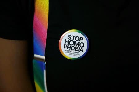 An LGBT activist wears a badge as he attends a court hearing in the Milimani high Court in Nairobi in Nairobi, Kenya. February 22, 2019. REUTERS/Baz Ratner