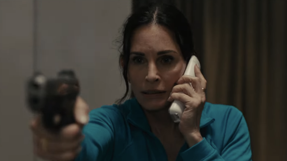 Courteney Cox with a gun in Scream VI