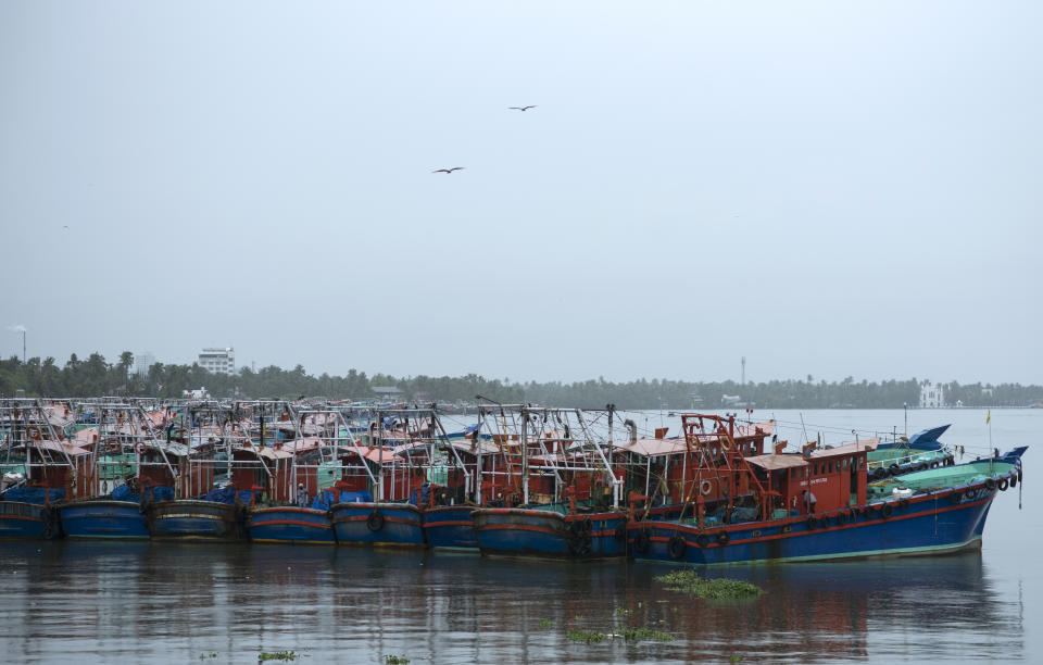 Fishing boats that stayed off the Arabian Sea due to Cyclone Tauktae are anchored in the backwaters in Kochi, Kerala state, India, Sunday, May 16, 2021. A severe cyclone is roaring in the Arabian Sea off southwestern India with winds of up to 140 kilometers per hour (87 miles per hour), already causing heavy rains and flooding that have killed at least four people, officials said Sunday. (AP Photo/R S Iyer)