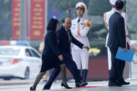 Vietnam's Prime Minister Nguyen Xuan Phuc, second left, arrives for the opening ceremony of the 13th National Congress of Vietnam's Communist Party (VCP), in Hanoi, Vietnam Tuesday, Jan. 26, 2021. (AP Photo/Minh Hoang)