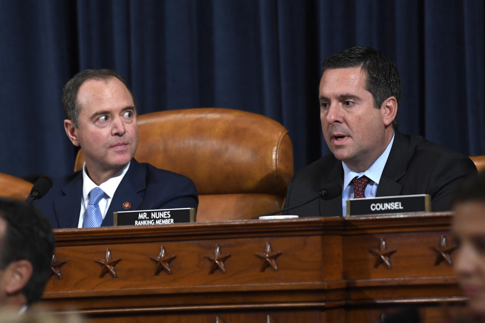 Chairman of the House Intelligence Committee Adam Schiff, D-Calif., left, listens as ranking member Rep. Devin Nunes, R-Calif., questions former U.S. Ambassador to Ukraine Marie Yovanovitch at the House Intelligence Committee on Capitol Hill in Washington, Friday, Nov. 15, 2019, in the second public impeachment hearing of President Donald Trump's efforts to tie U.S. aid for Ukraine to investigations of his political opponents. (AP Photo/Susan Walsh)