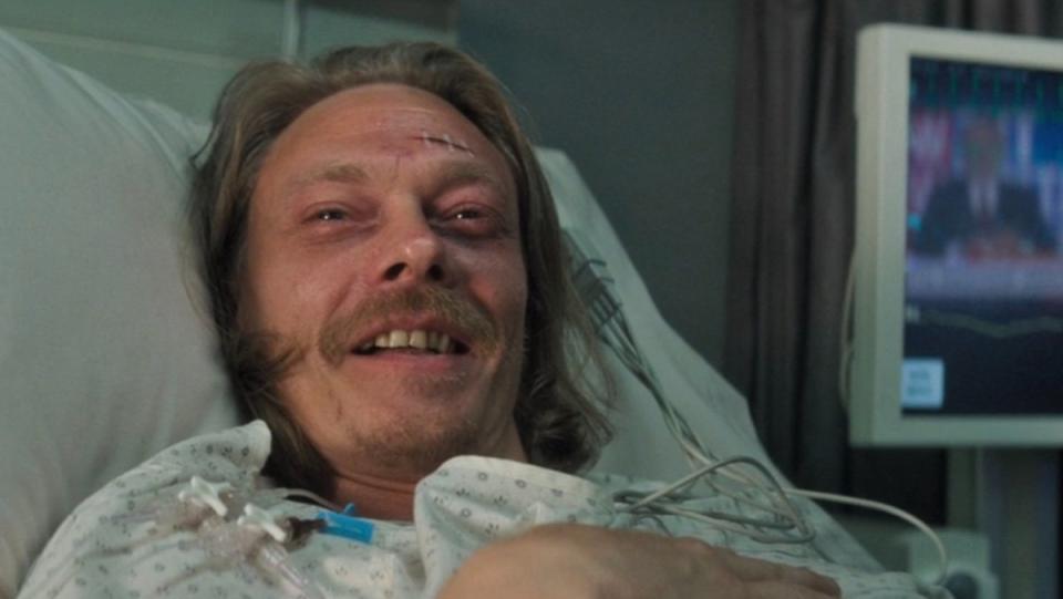 A man with a head wound smiles in a hospital bed in Mission: Impossible - Fallout