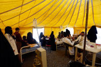<p>Yemenis infected with cholera wait for treatment at Sabaeen Hospital in Sana’a, on June 13, 2017.<br> Six weeks into the second outbreak of the deadly disease in less than a year, at least one patient checks in at Sabaeen every 60 seconds — a level of emergency that overwhelms staff. (Mohammed Huwais/AFP/Getty Images) </p>