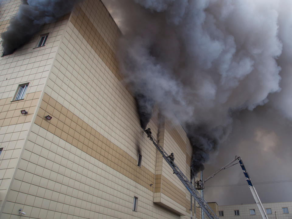 <p>Members of the Emergency Situations Ministry work to extinguish a fire in a shopping mall in the Siberian city of Kemerovo, Russia, on March 25, 2018. (Photo: Marina Lisova/Reuters) </p>