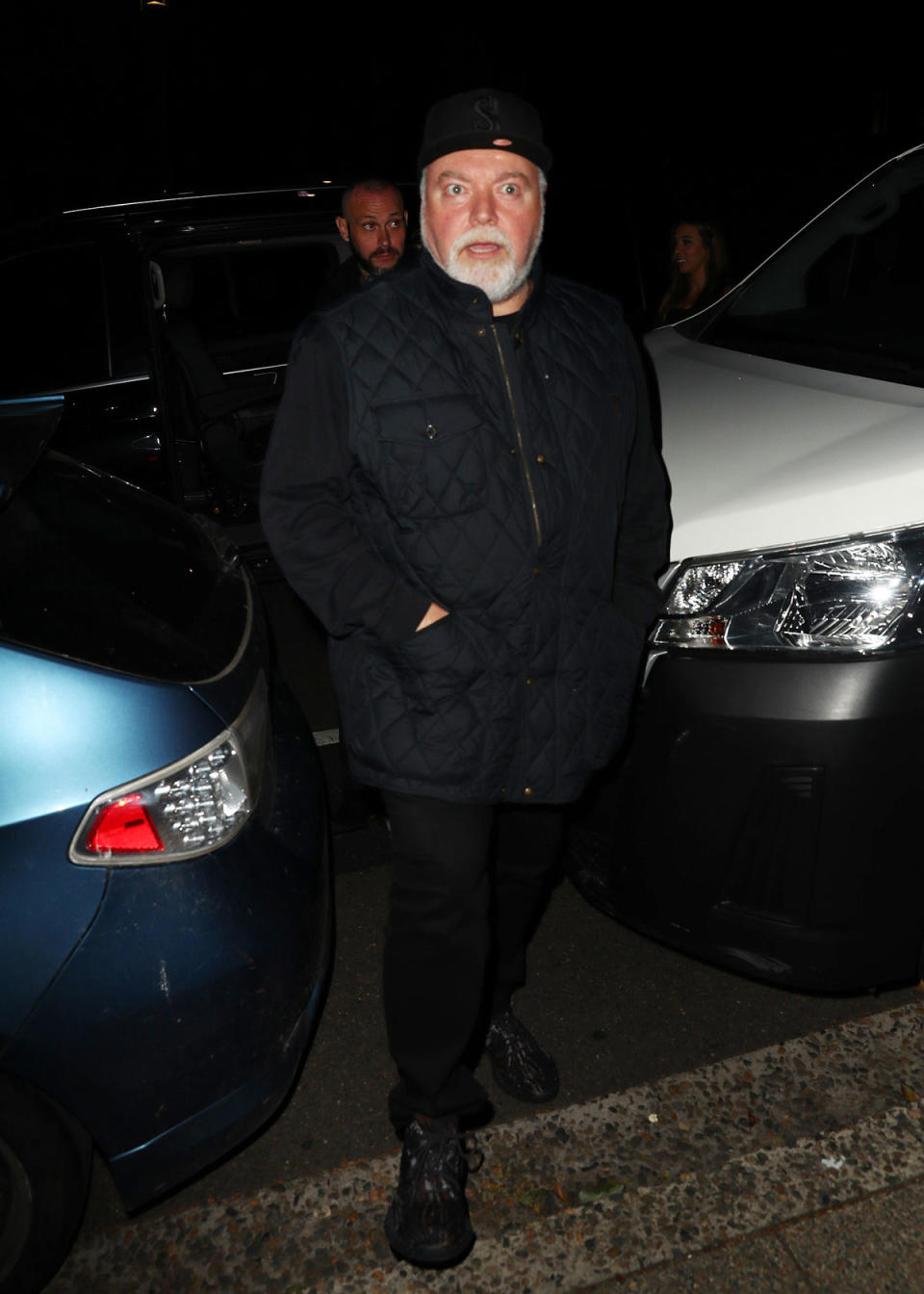 Kyle Sandilands in a black outfit for his 52nd birthday