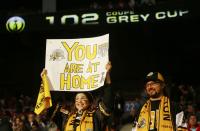 Hamilton Tiger Cats fans cheer before the start of the CFL's 102nd Grey Cup football championship between the Calgary Stampeders and the Tiger Cats in Vancouver, British Columbia, November 30, 2014. REUTERS/Mark Blinch (CANADA - Tags: SPORT FOOTBALL)