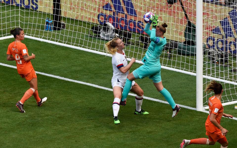 Sam Mewis challenges Netherlands' goalkeeper Sari van Veenendaal at the World Cup - AFP