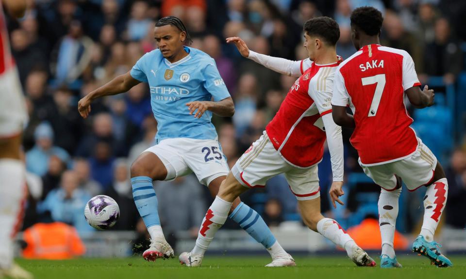 <span>Manchester City’s Manuel Akanji (centre) has questioned the display of referee Anthony Taylor in Sunday’s goalless draw against Arsenal.</span><span>Photograph: Tom Jenkins/The Guardian</span>