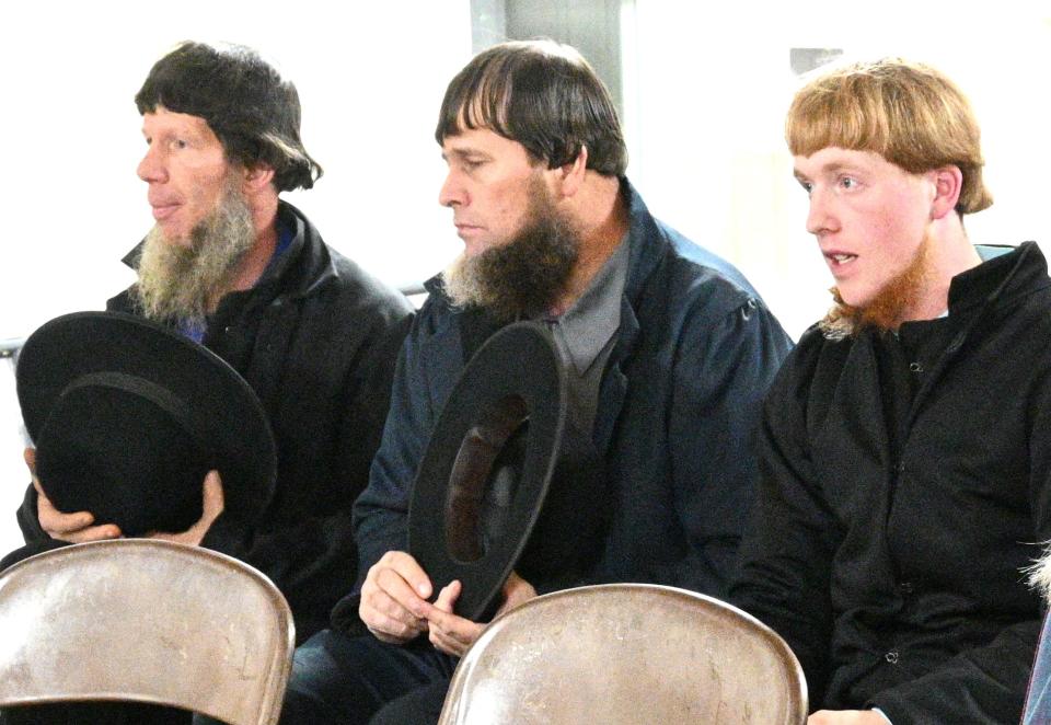 Alvin Graber, right, and family members explain the dog breeding operation to the Planning Commission.