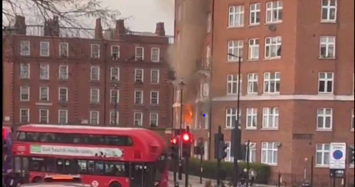 Footage shows flames pouring out of a flat window (@steveswimmer)
