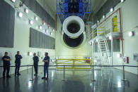 Engineers and workers stand inside Safran Aircraft Engines repair plant outside of Casablanca, Morocco, Thursday, April 18, 2024. Moroccan officials are aiming to turn the country into an aerospace hub, luring investors and manufacturers who have aimed to spread out their supply chains and find willing workers since the COVID-19 pandemic. (AP Photo)