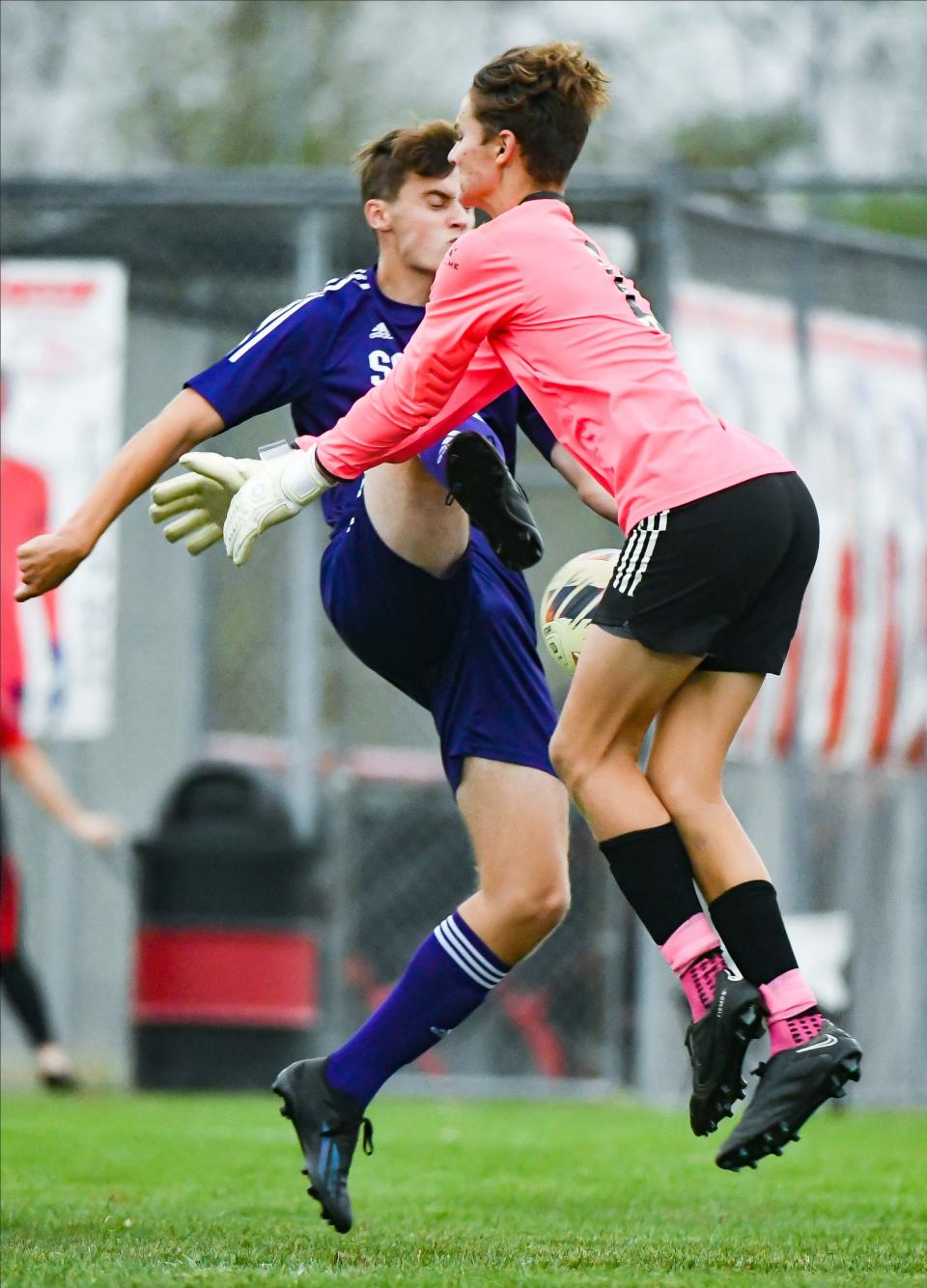 Bloomington South’s James Ryan (23) and Martinsville goalie Quinlan McGown collide going after the ball during their IHSAA Boys’ soccer sectional match at Terre Haute South on Wednesday, Oct. 4, 2023. Ryan would score on the play.