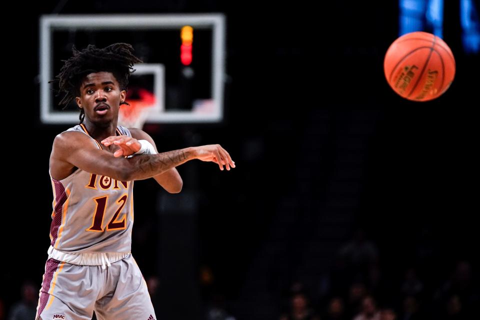 Iona guard Anton Brookshire passes the ball during an NCAA college basketball game against St. Bonaventure in the Basketball Hall of Fame Invitational, Sunday, Dec. 11, 2022, in New York. The Gaels won 72-57. (AP Photo/Julia Nikhinson)