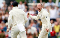 Cricket - England v Sri Lanka, First Test - Galle, Sri Lanka - November 9, 2018. England's Jack Leach (R) celebrates with teammates after taking the wicket of Sri Lanka's Kaushal Silva (not pictured). REUTERS/Dinuka Liyanawatte