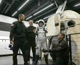 In this image taken from video, Hayley Arceneaux, one of four passengers aboard the SpaceX capsule, reacts after emerging from the capsule Saturday, Sept. 18, 2021, after it was recovered following its splashdown in the Atlantic off the Florida coast. The all-amateur crew was the first to circle the world without a professional astronaut. (Inspiration4 via AP)