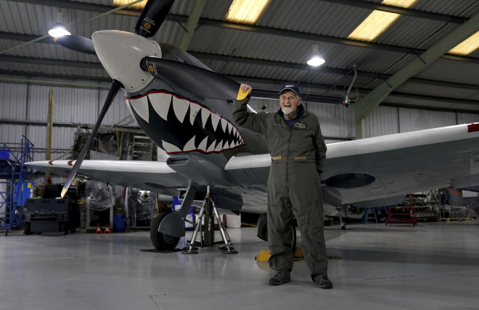 Jack Hemmings, 102, AFC, waves during interviews before flying a Spitfire plane to mark 80th anniversary of the military charity Mission Aviation Fellowship (MAF) at Heritage Hanger at London Biggin Hill, England, Monday, Feb. 5, 2024. The former RAF Squadron Leader and pioneer of MAF, the world's largest humanitarian air service, hopes to become the oldest Briton to fly in a spitfire. Hemmings will take to the skies in Britain's best-loved Second World War aircraft to raise money for MAF, the charity he co-founded almost 80 years ago. (Gareth Fuller/PA via AP)