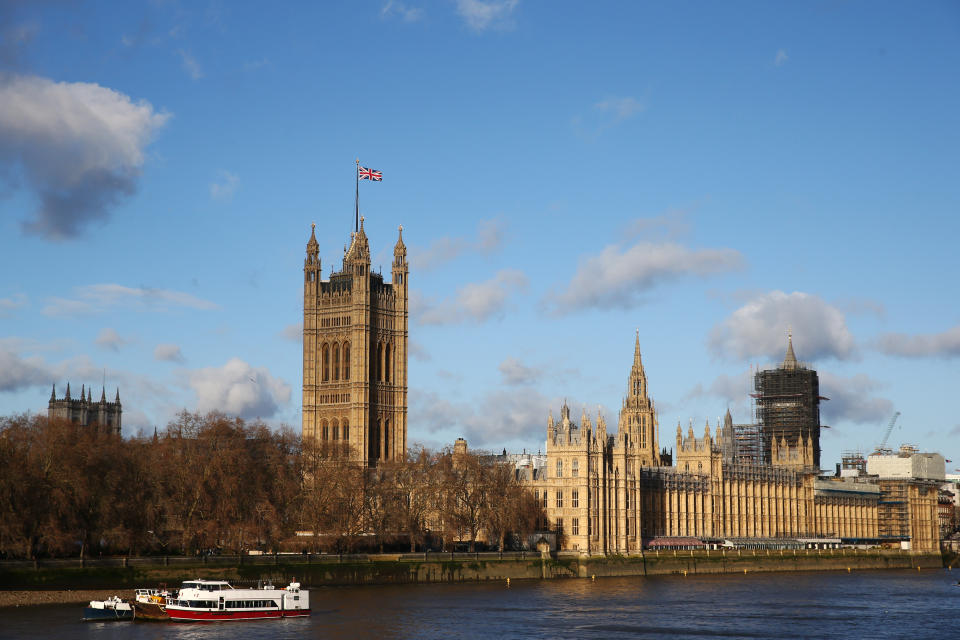 The Union Jack flying over Victoria Tower at the Houses of Parliament in London.